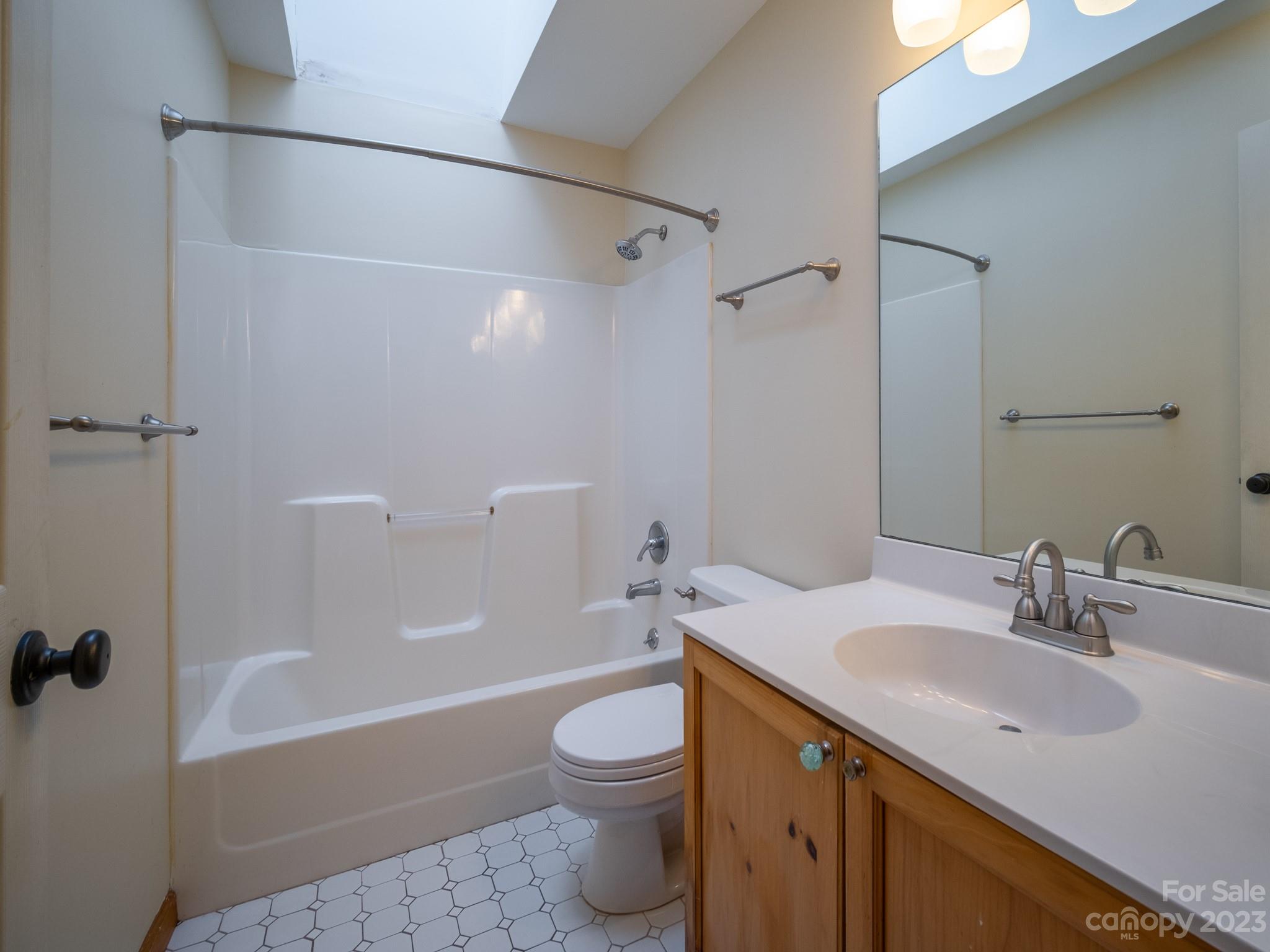 430 Jeep Road Brevard, NC 28712 - Photo 29 of 45 a bathroom with a sink a toilet and shower