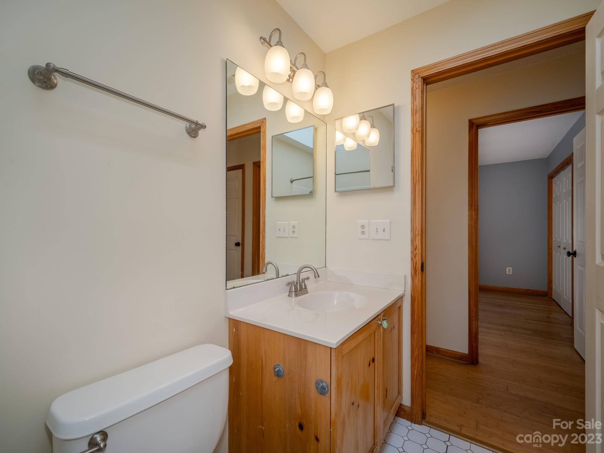 430 Jeep Road Brevard, NC 28712 - Photo 30 of 45 a bathroom with a toilet sink and mirror