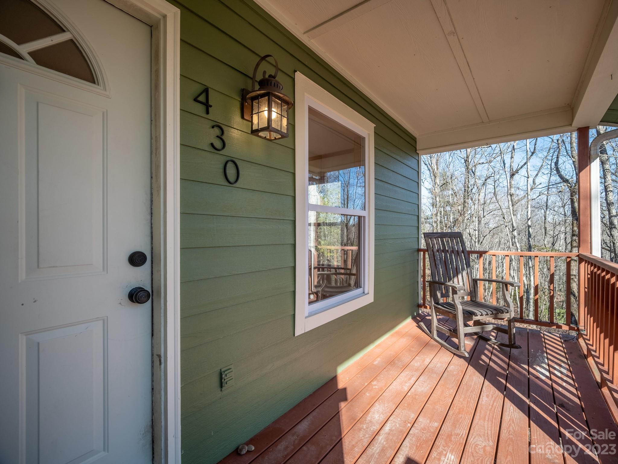 430 Jeep Road Brevard, NC 28712 - Photo 3 of 45 a balcony view with a couple of chairs and a wooden floor