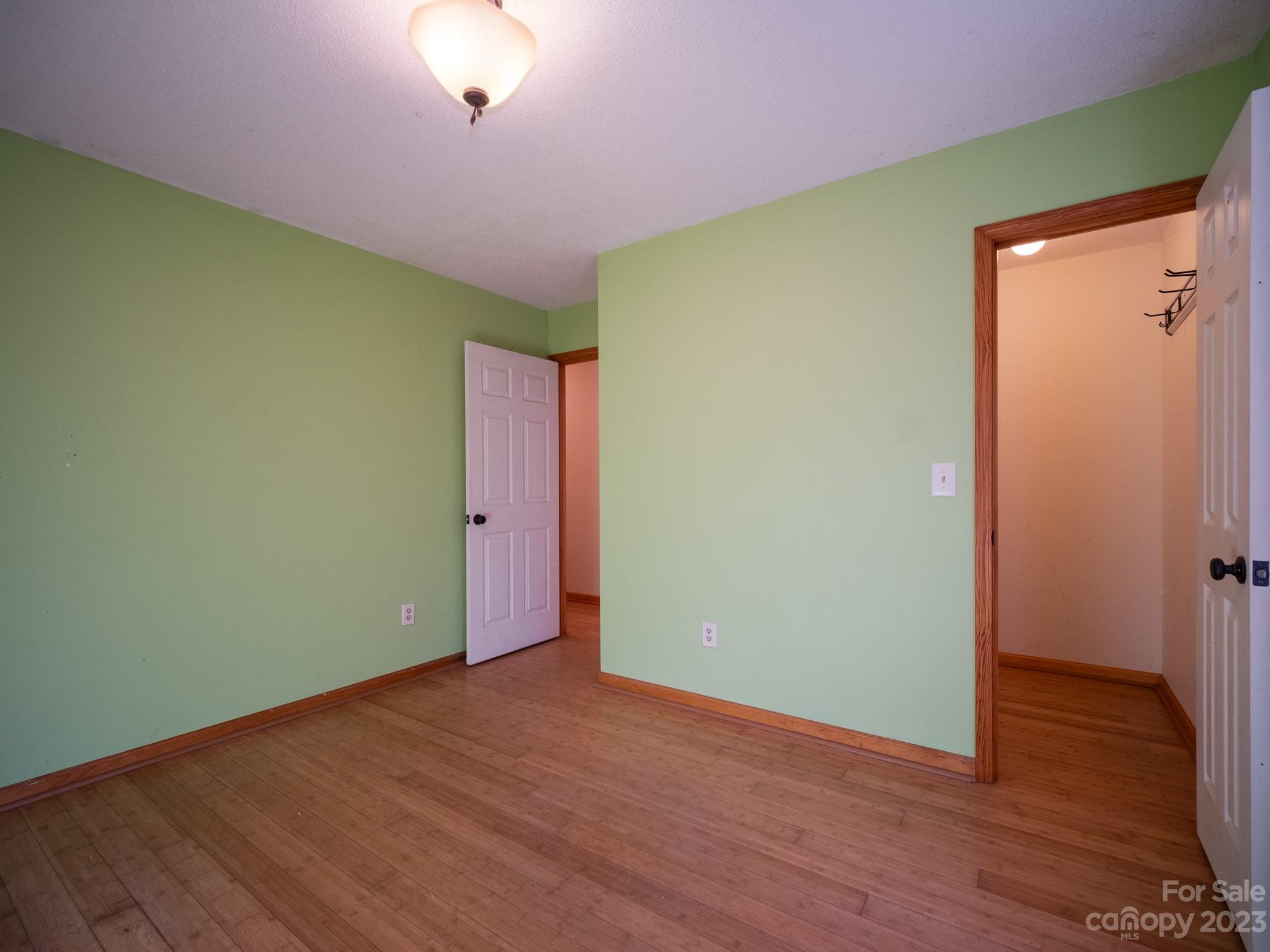 430 Jeep Road Brevard, NC 28712 - Photo 35 of 45 a view of an empty room with wooden floor and a window