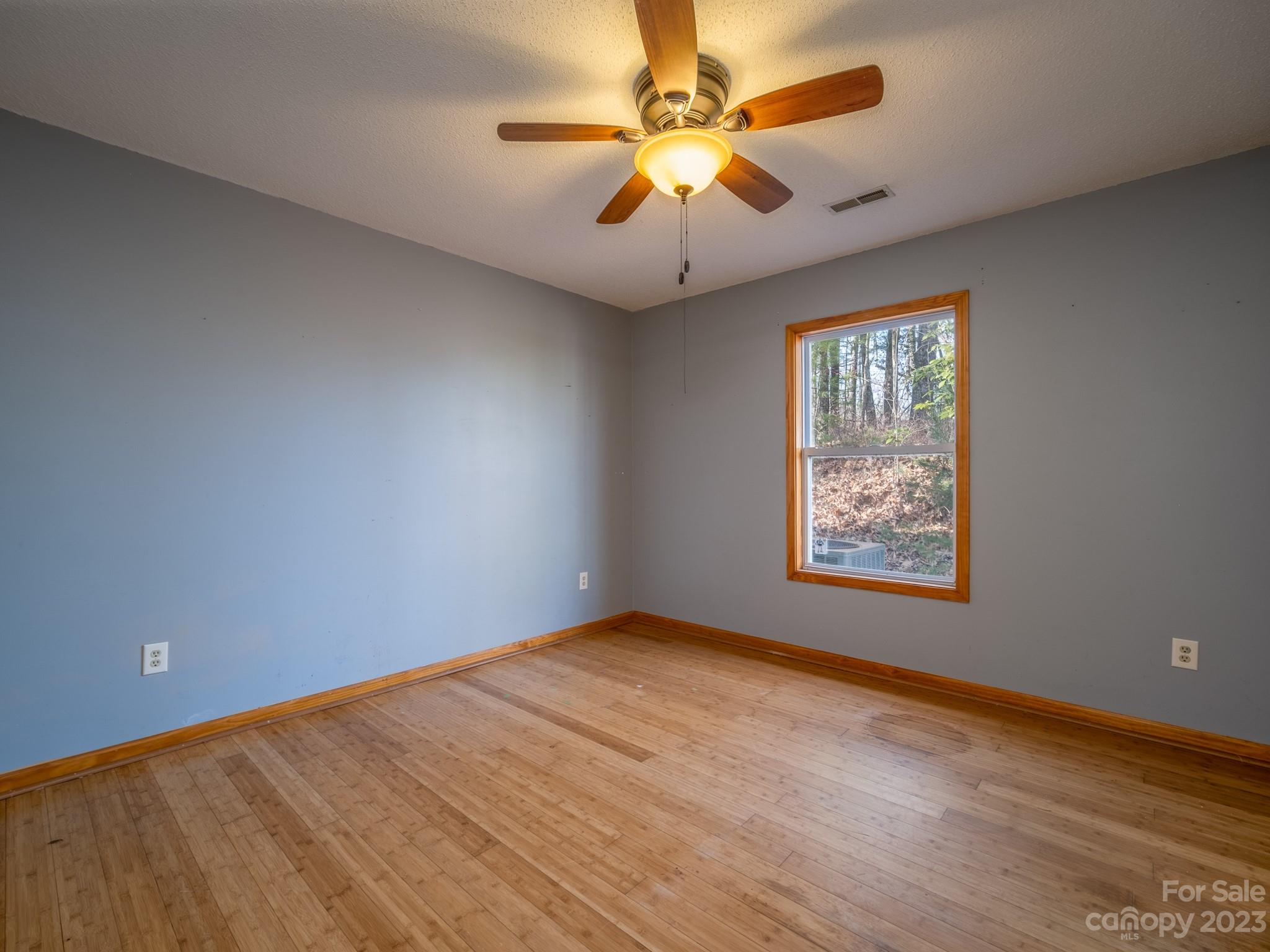 430 Jeep Road Brevard, NC 28712 - Photo 36 of 45 an empty room with windows and fan