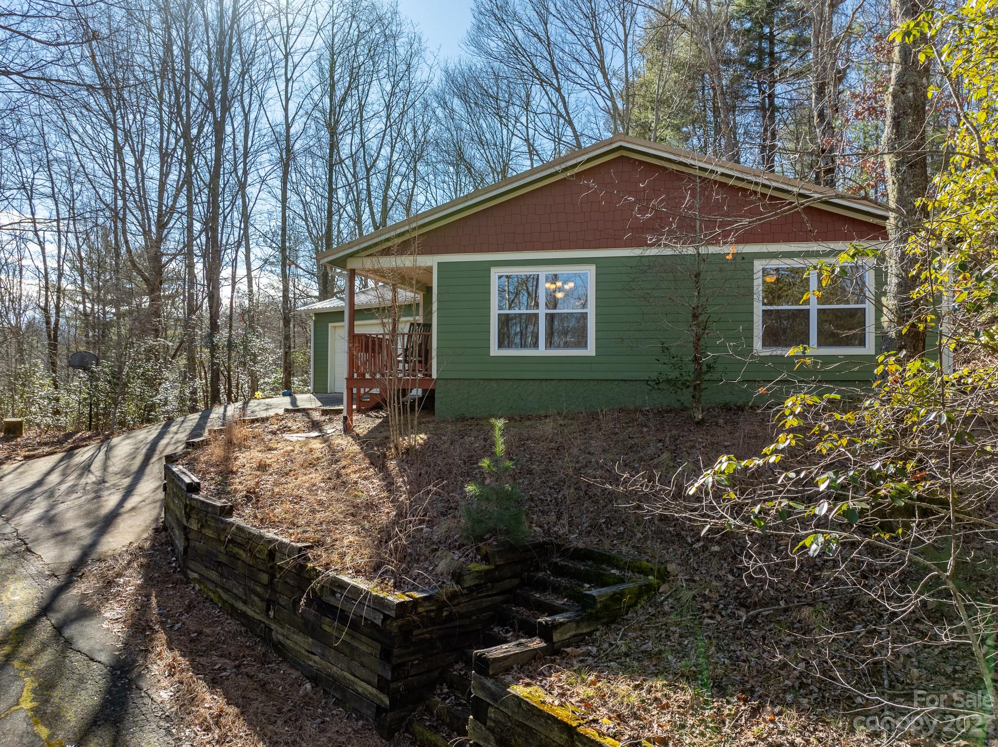 430 Jeep Road Brevard, NC 28712 - Photo 6 of 45 a front view of a house with garden