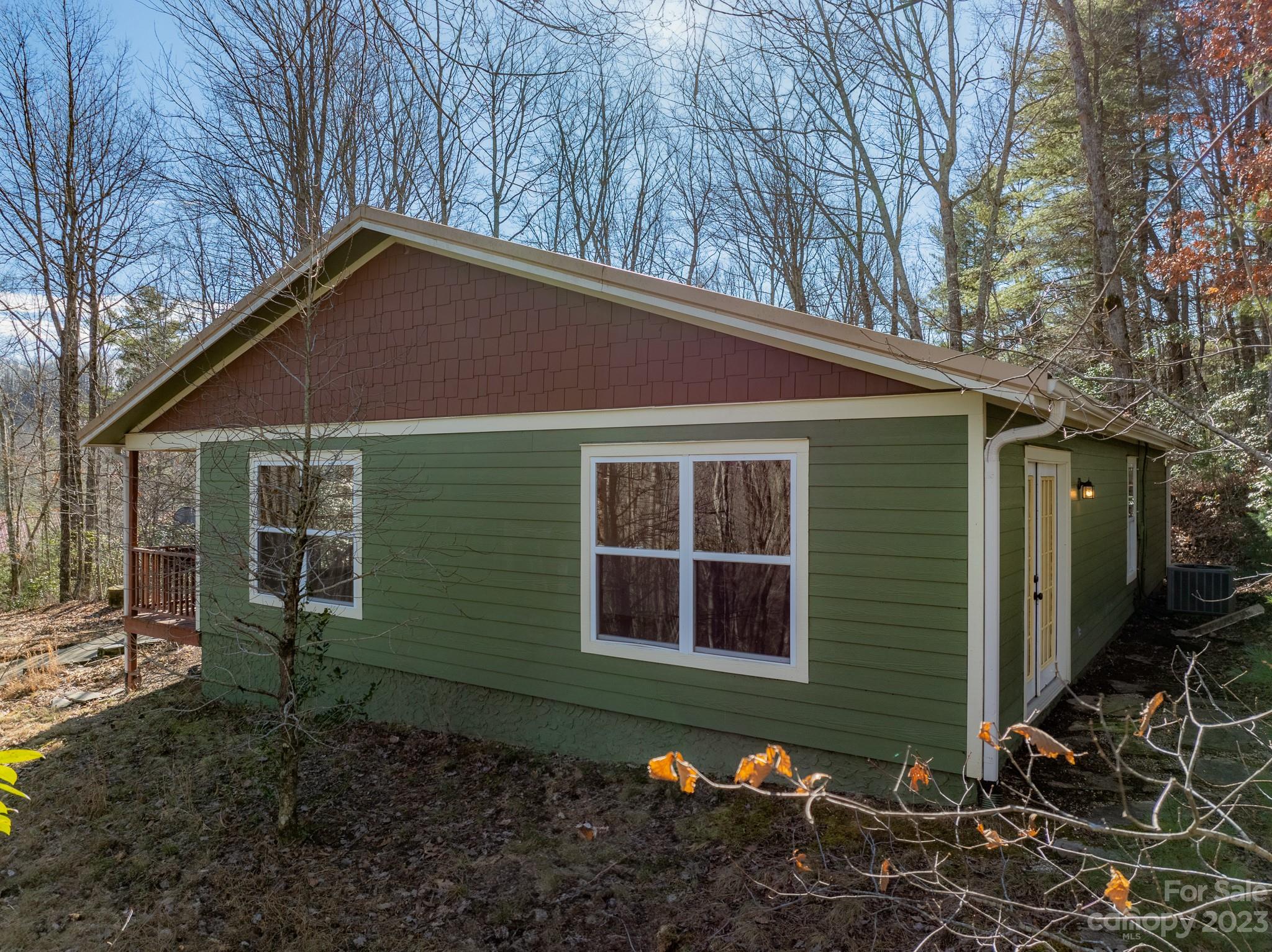430 Jeep Road Brevard, NC 28712 - Photo 7 of 45 a front view of a house with garden