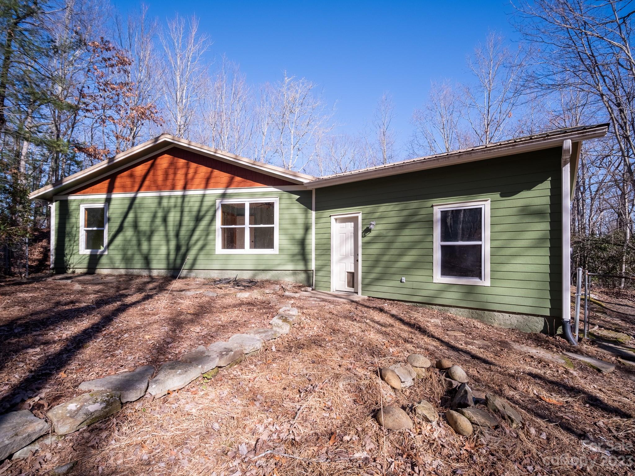 430 Jeep Road Brevard, NC 28712 - Photo 8 of 45 a front view of a house with garden