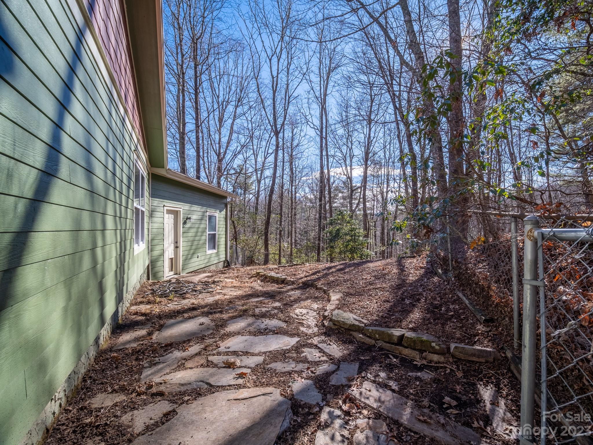430 Jeep Road Brevard, NC 28712 - Photo 10 of 45 a view of a house with backyard and trees