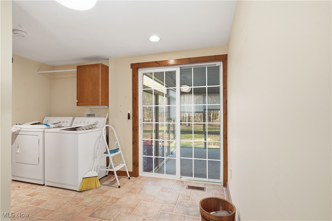 3275 Ranfield Road Kent, OH 44240 - Photo 21 of 33 Laundry area with stone finish flooring, cabinet space, washer and dryer, and recessed lighting