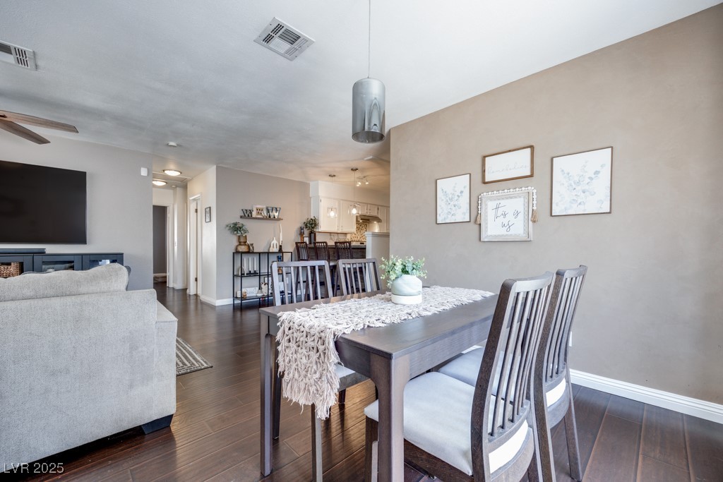 6444 Peartree Road Las Vegas, NV 89108 - Photo 7 of 33 Dining room with pendant lighting and laminate flooring