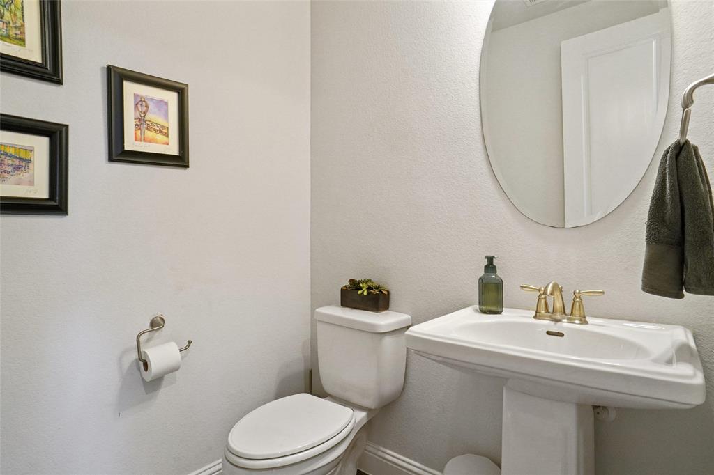 2202 Stanhill Drive Corinth, TX 76210 - Photo 11 of 29 a bathroom with a sink mirror and toilet