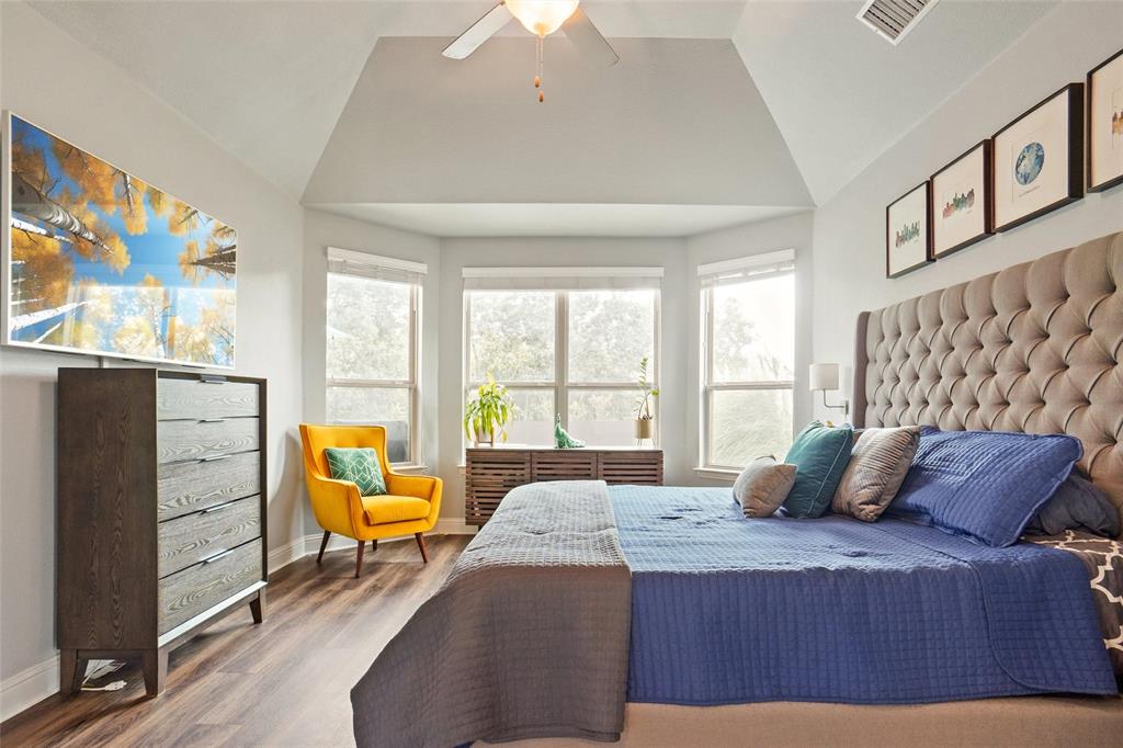 2202 Stanhill Drive Corinth, TX 76210 - Photo 13 of 29 a bedroom with a bed and large windows