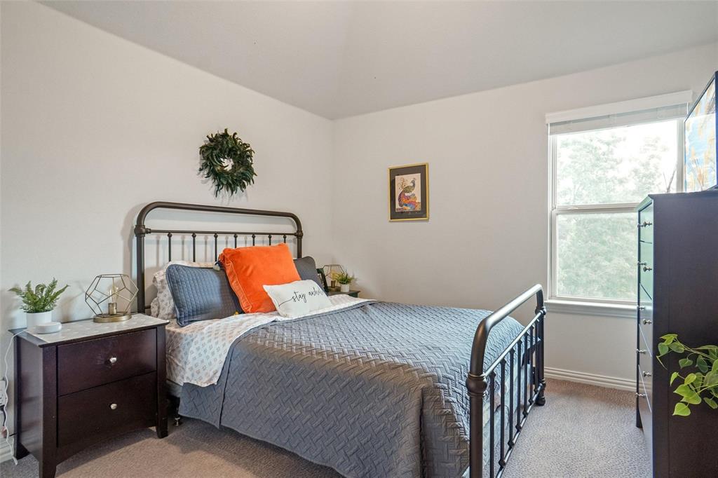 2202 Stanhill Drive Corinth, TX 76210 - Photo 22 of 29 a bedroom with a bed and a window