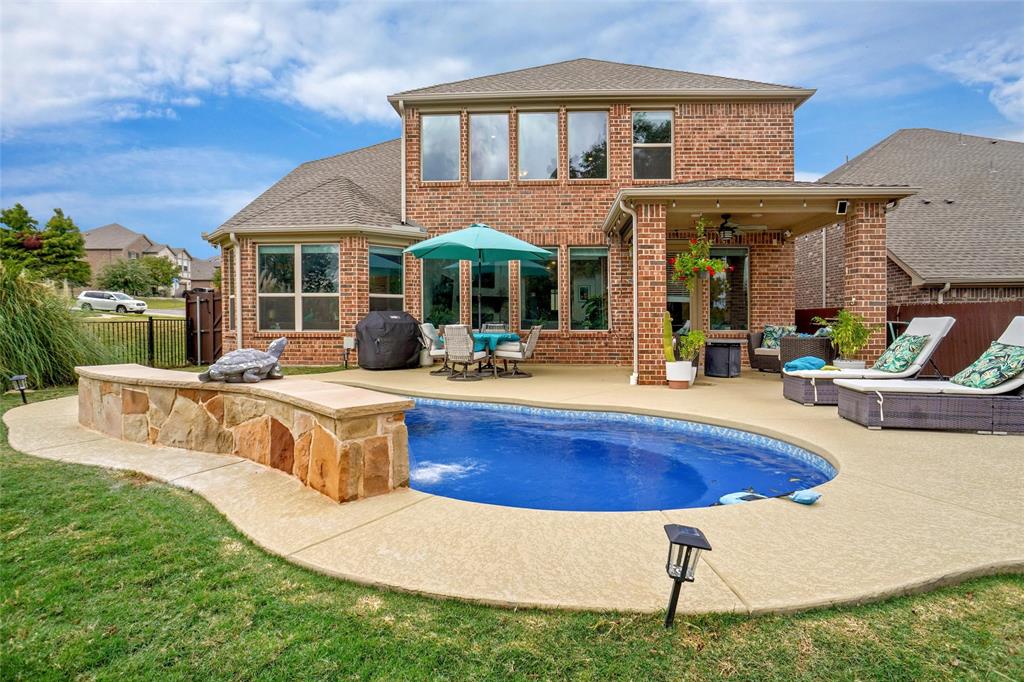 2202 Stanhill Drive Corinth, TX 76210 - Photo 27 of 29 a view of a house with swimming pool and a chairs