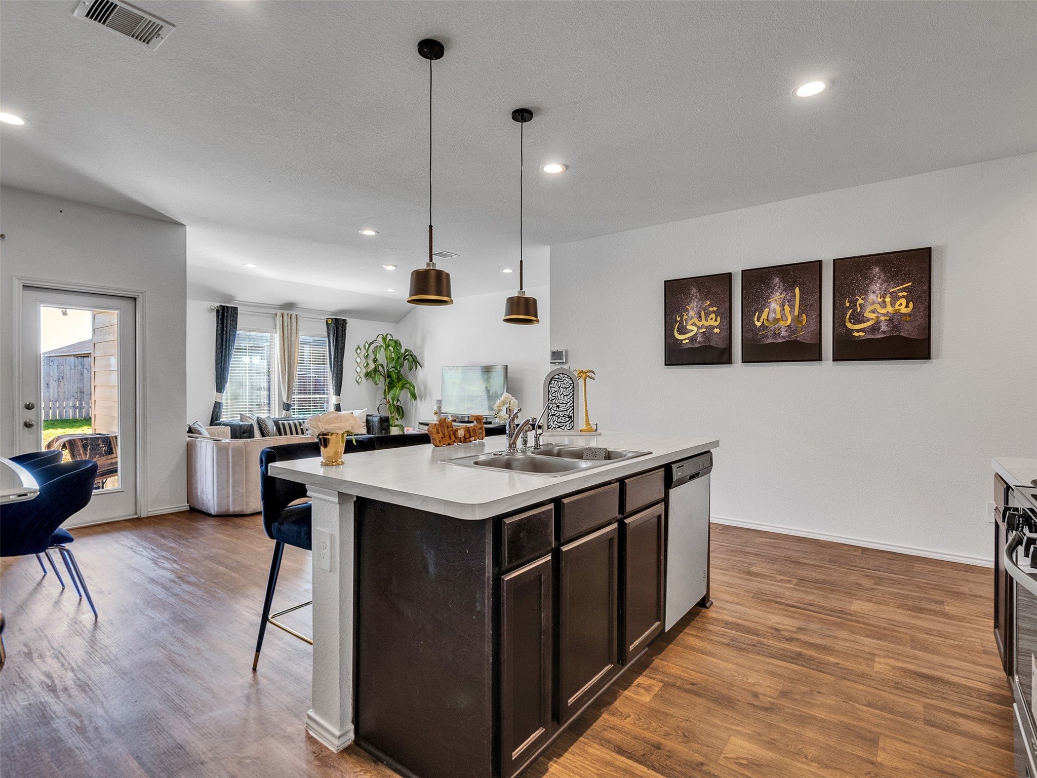 21215 Audubon Russet Road Katy, TX 77449 - Photo 14 of 30 a kitchen with a sink and stove