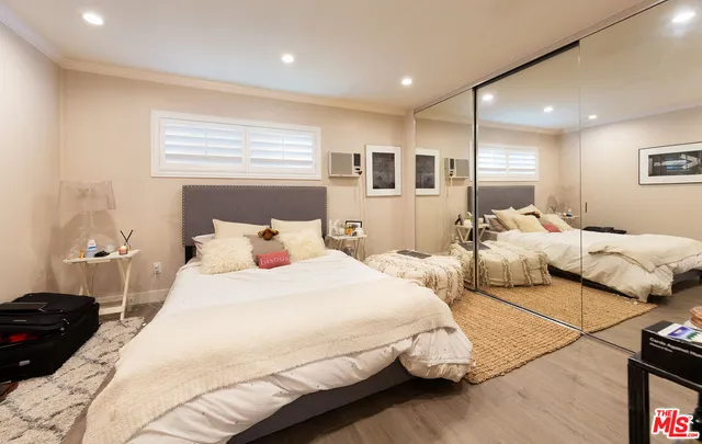 a bathroom with a granite countertop toilet sink and a mirror