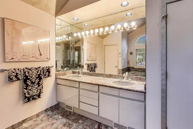 a view of a patio with couches chairs and wooden floor