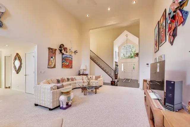 a dining room with furniture and wooden floor
