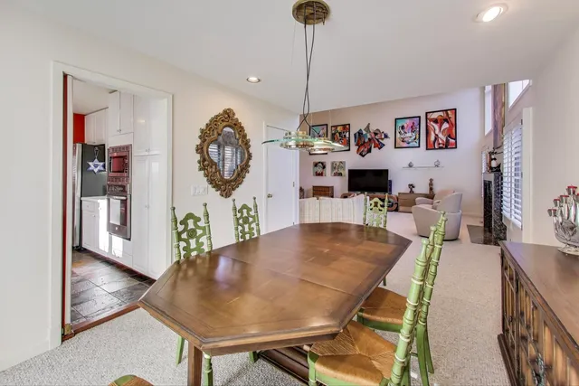 a bedroom with a bed and glass walk in closet
