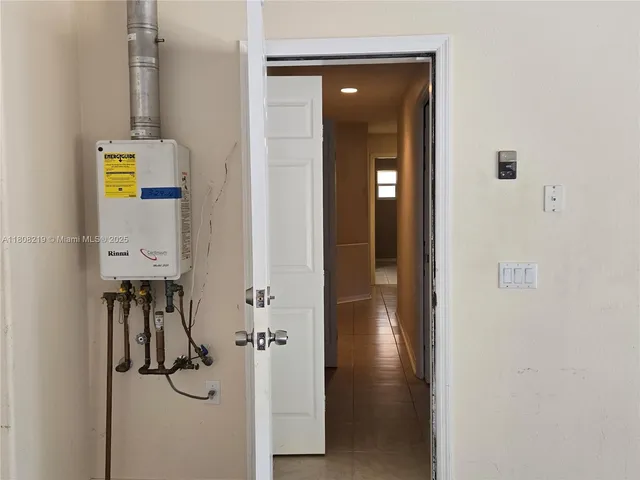 a view of a closet area with hardwood floor