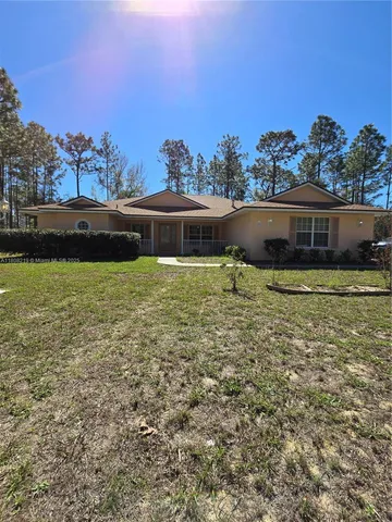 a view of a lake with houses in the back