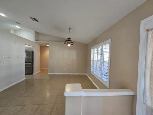 a view of a bathroom from a hallway