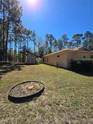 a view of a swimming pool with an outdoor seating