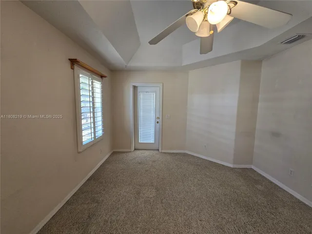 a view of a house with a yard and a street