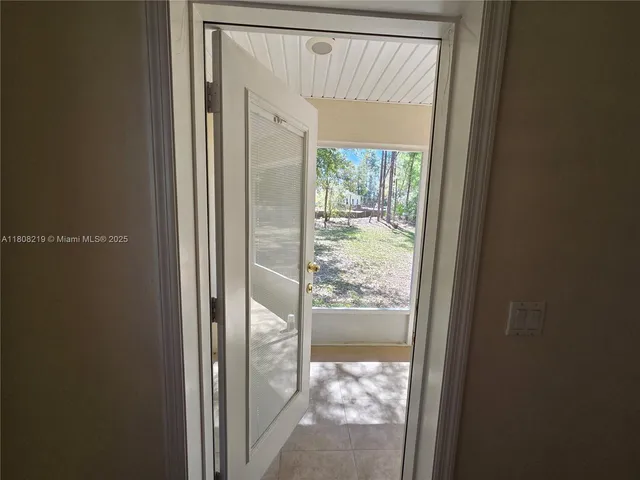 a view of an empty room with a balcony