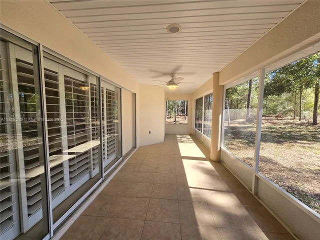 an empty room that has a window in it