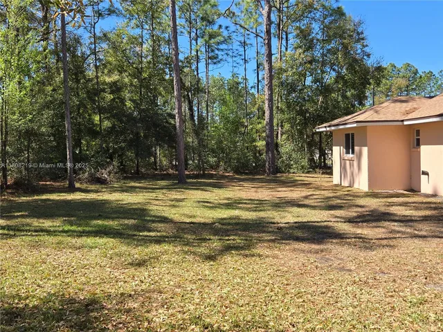 a kitchen with cabinets and stainless steel appliances