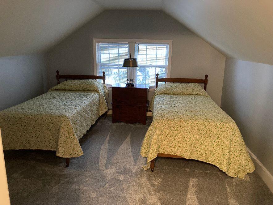 316 Cap'n Lijah's Road Centerville, MA 02632 - Photo 27 of 45 a bedroom with a bed and window