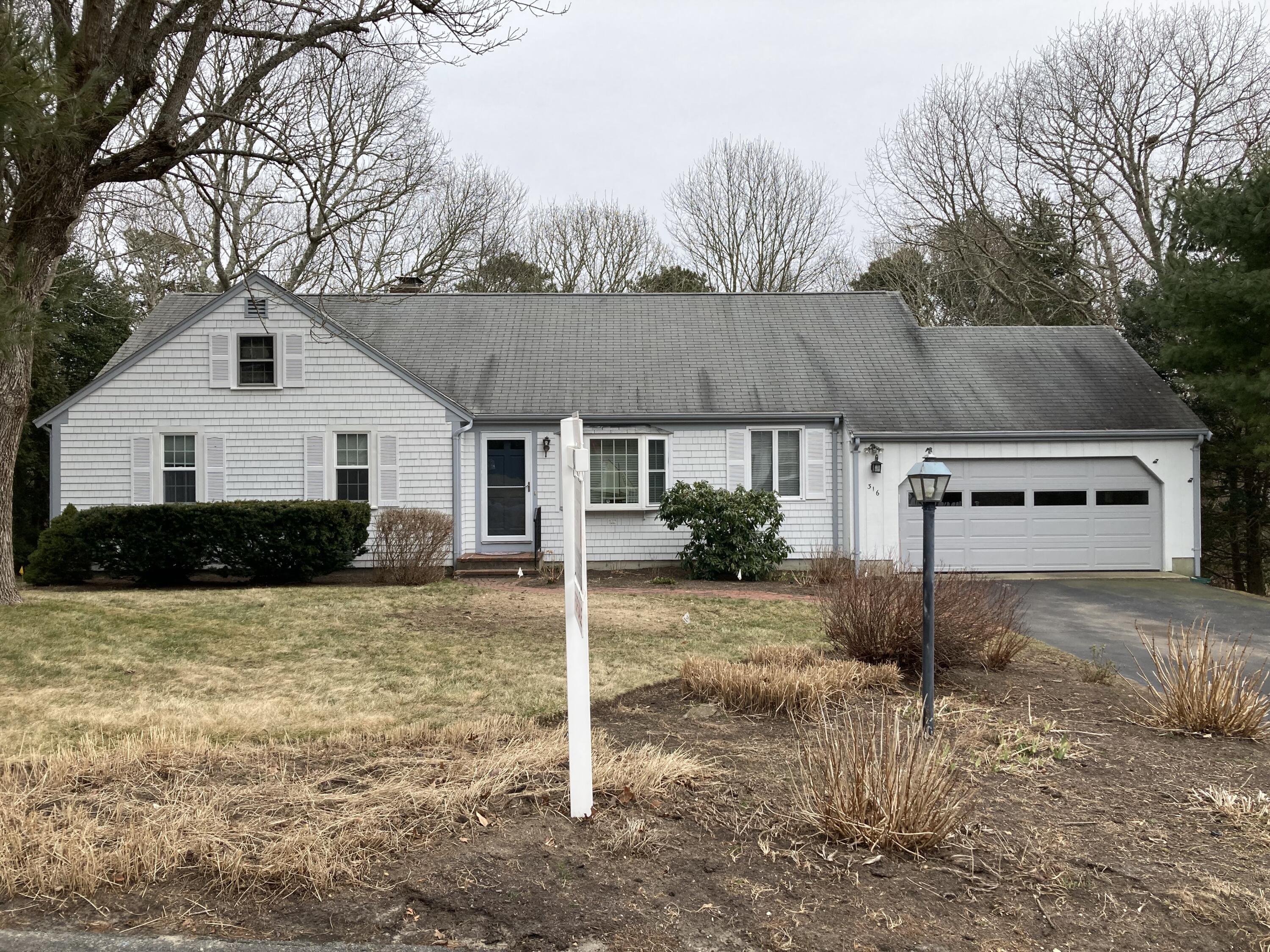 316 Cap'n Lijah's Road Centerville, MA 02632 - Photo 36 of 45 a front view of a house with a yard