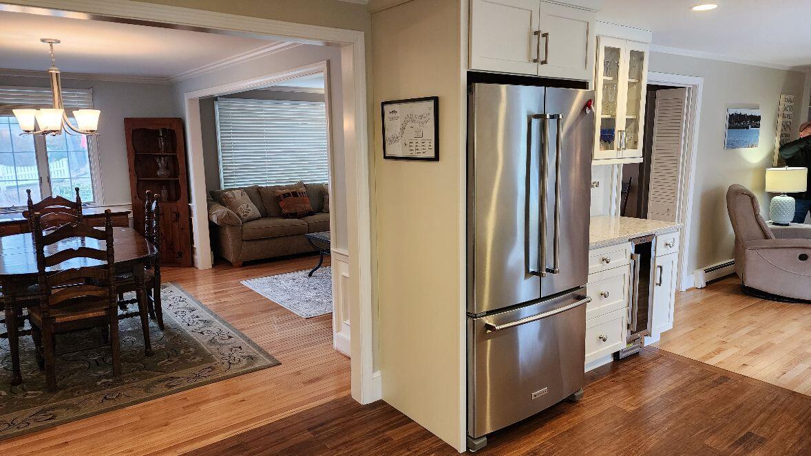 316 Cap'n Lijah's Road Centerville, MA 02632 - Photo 8 of 45 a kitchen with stainless steel appliances a refrigerator sink and cabinets
