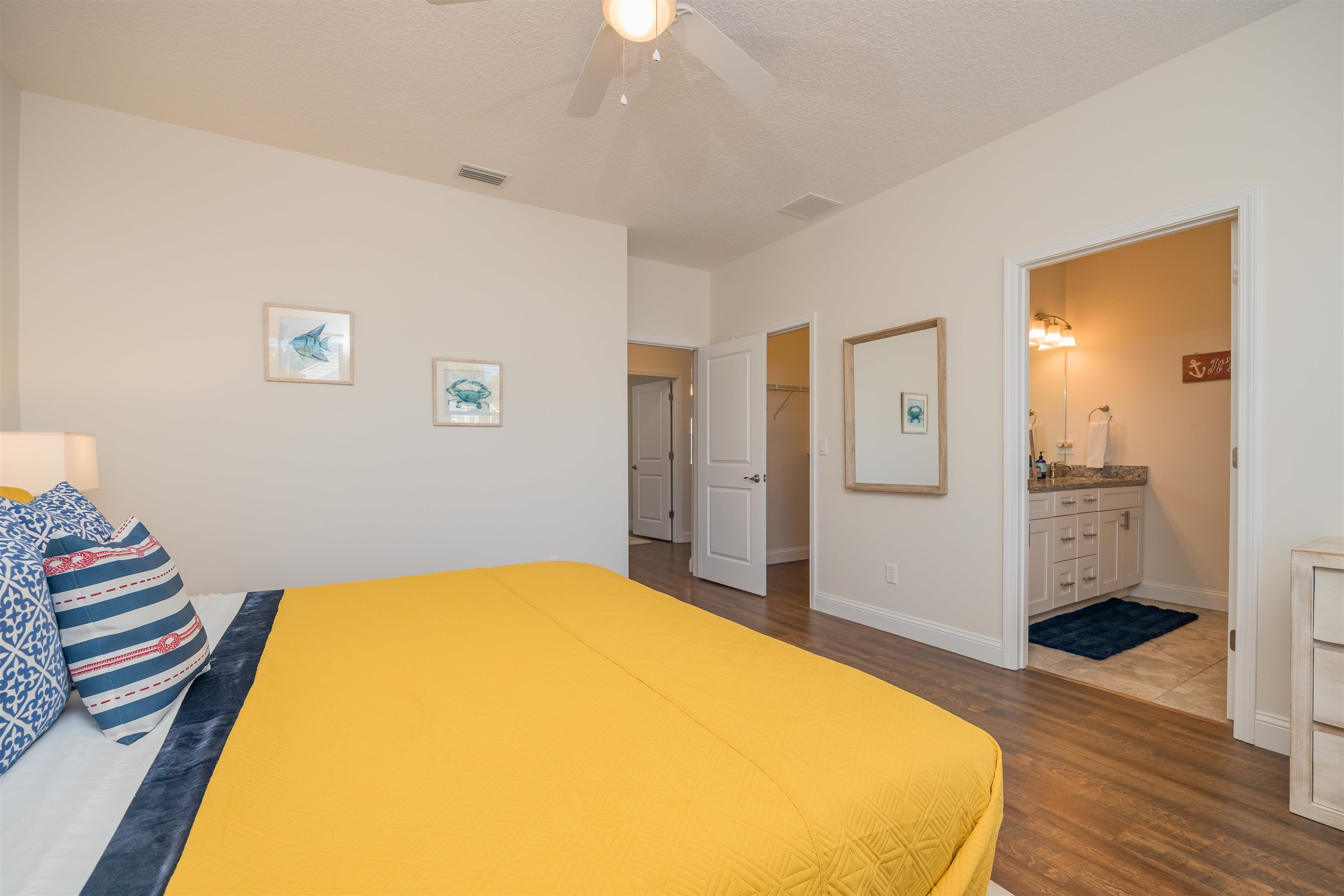 6832 Middleton Avenue St. Augustine, FL 32080 - Photo 20 of 47 a spacious bedroom with a bed and wooden floor