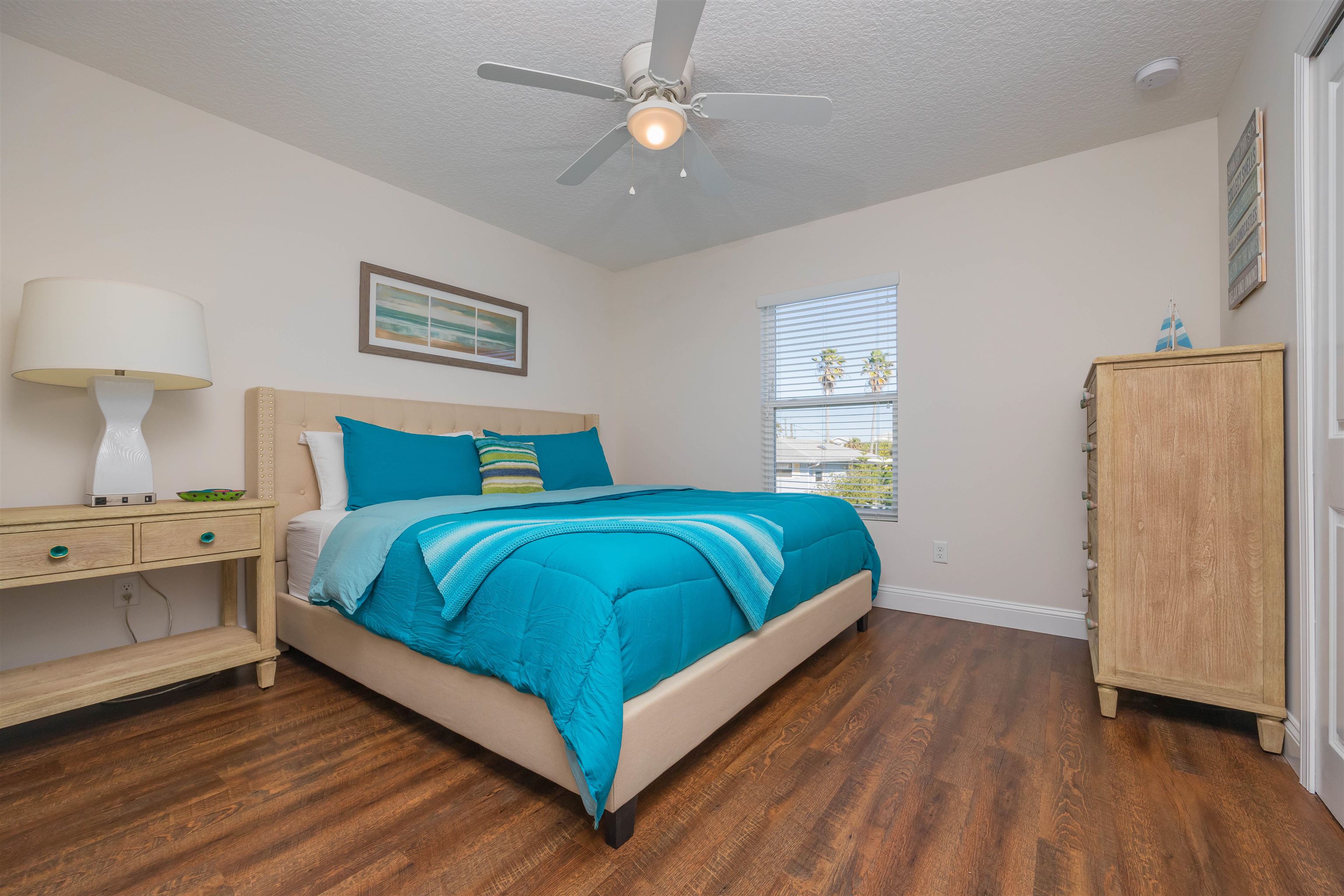 6832 Middleton Avenue St. Augustine, FL 32080 - Photo 39 of 47 a bedroom with a bed and a chandelier