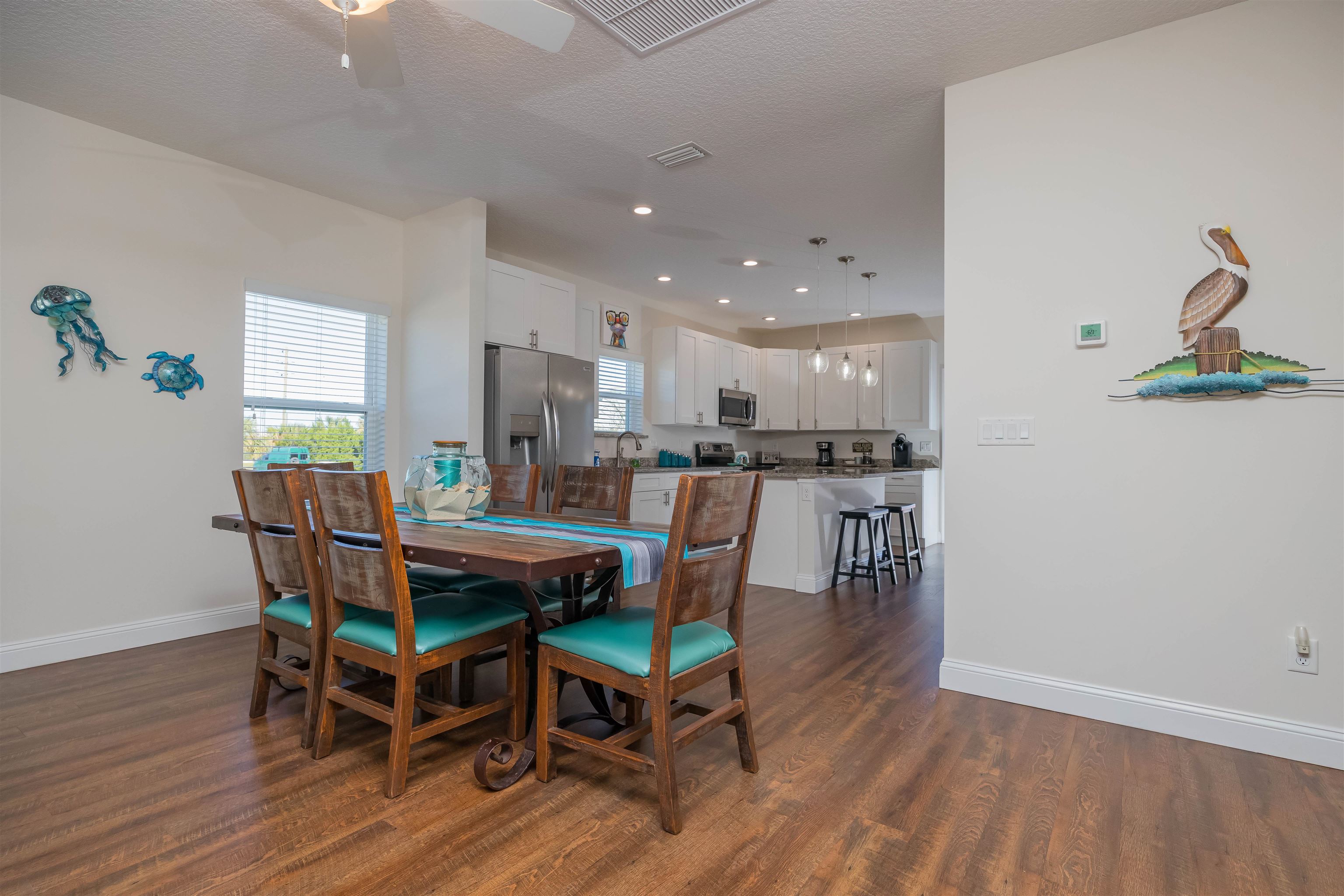 6832 Middleton Avenue St. Augustine, FL 32080 - Photo 9 of 47 a dining room with furniture and wooden floor