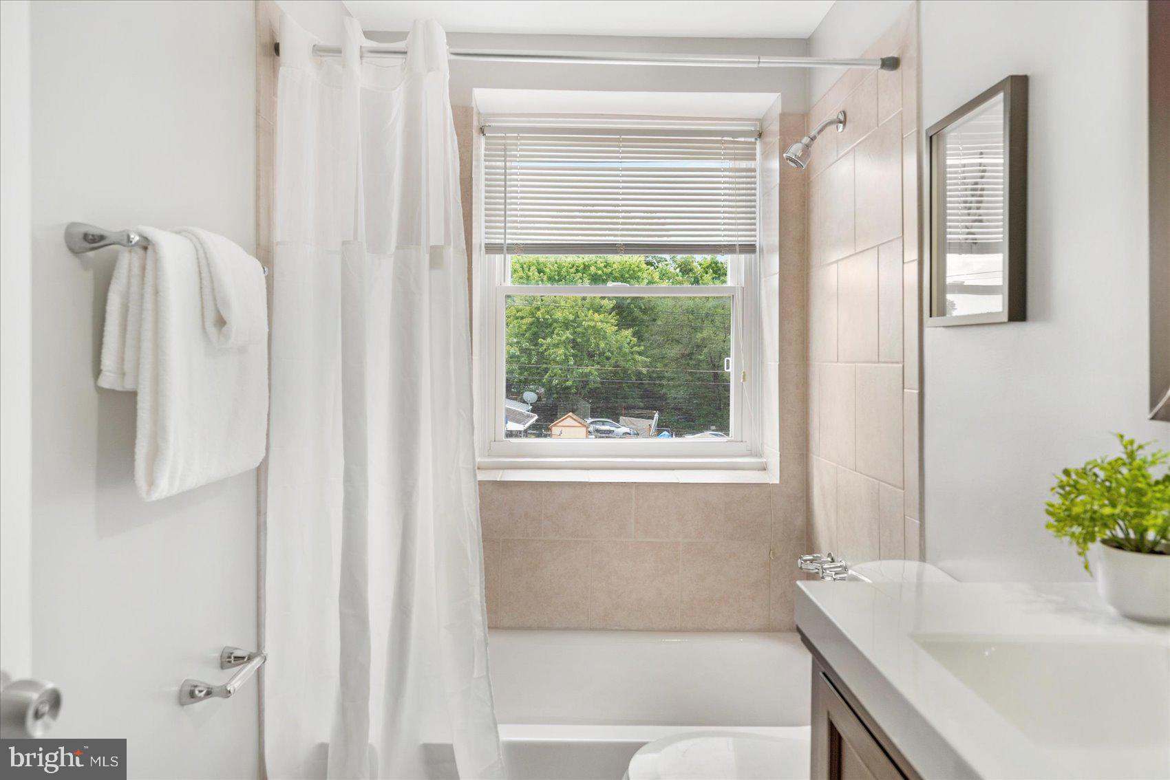 36 Bladen Road Essex, MD 21221 - Photo 29 of 34 a bathroom with a granite countertop bathtub and shower