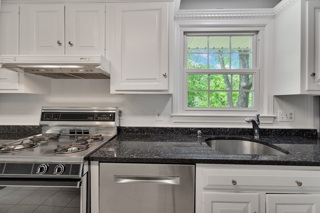 1 Potter Road Framingham, MA 01701 - Photo 13 of 41 a kitchen with stainless steel appliances granite countertop a sink a stove and a granite counter tops