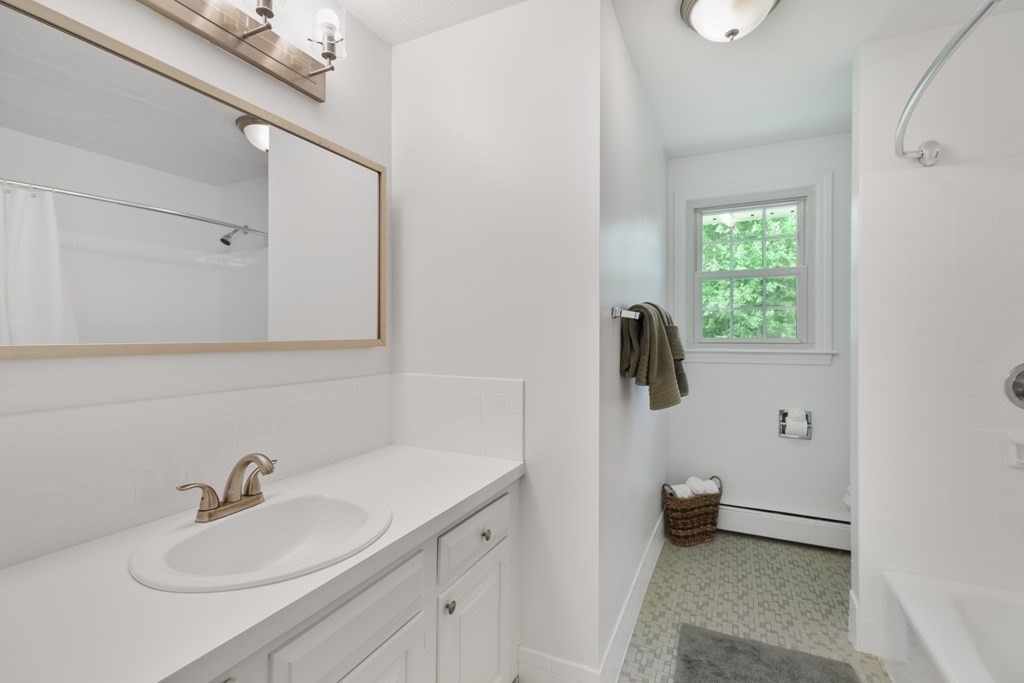 1 Potter Road Framingham, MA 01701 - Photo 24 of 41 a bathroom with a sink and mirror