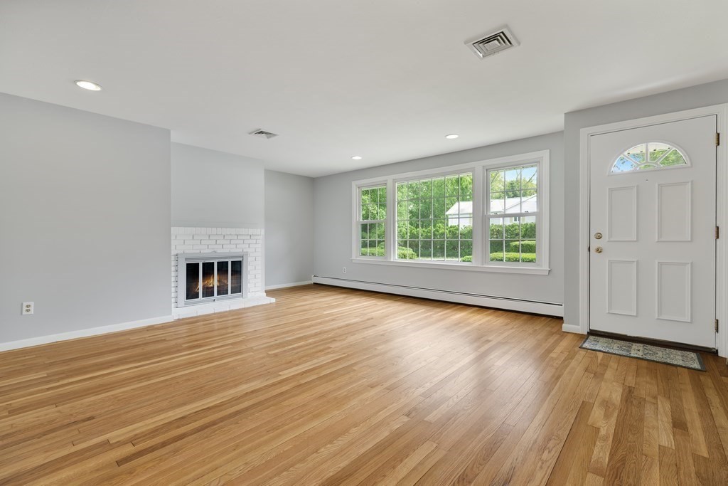 1 Potter Road Framingham, MA 01701 - Photo 6 of 41 an empty room with wooden floor and windows