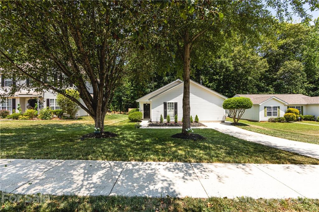 11207 Gold Pan Road Charlotte, NC 28215 - Photo 2 of 19 a front view of a house with a yard