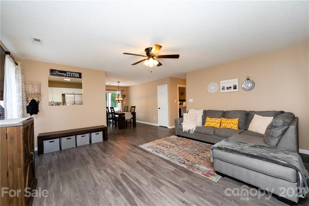 11207 Gold Pan Road Charlotte, NC 28215 - Photo 5 of 19 a living room with furniture and wooden floor