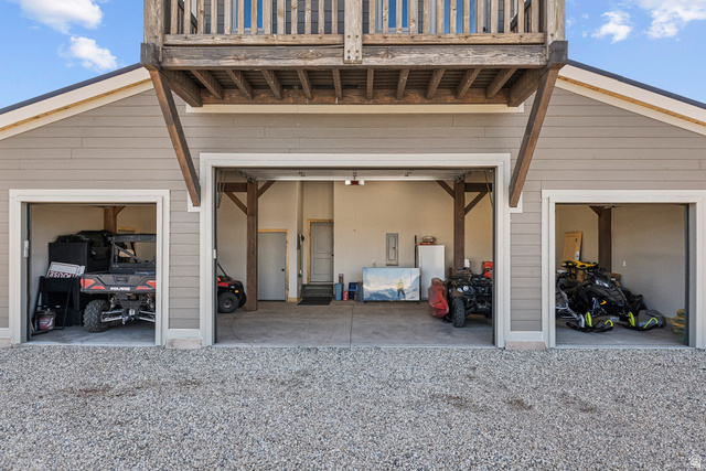 46997 West Thunder Road Fruitland, UT 84027 - Photo 47 of 49 Garage featuring freestanding refrigerator and electric panel