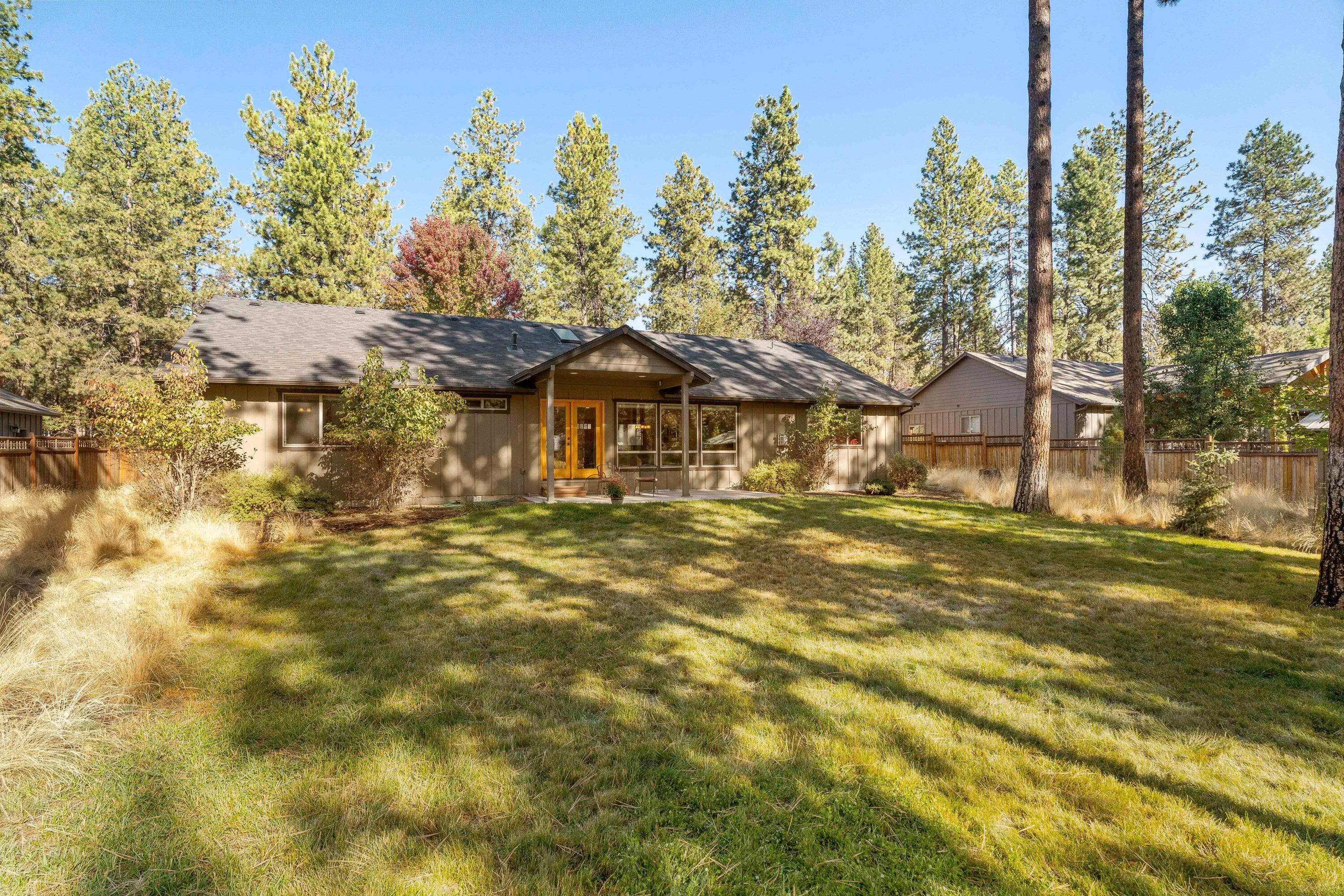 19031 Baker Road Bend, OR 97702 - Photo 28 of 35 a front view of a house with a garden