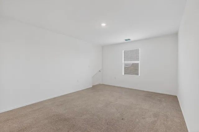 a kitchen with a sink cabinets and wooden floor