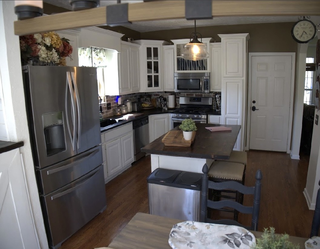 495 Calista Road White House, TN 37188 - Photo 12 of 28 a kitchen with a refrigerator a microwave a stove and cabinets