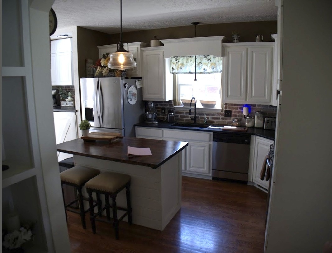 495 Calista Road White House, TN 37188 - Photo 13 of 28 a kitchen with kitchen island granite countertop a sink a counter space appliances and cabinets
