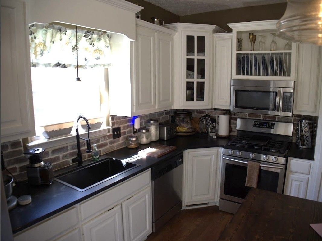 495 Calista Road White House, TN 37188 - Photo 14 of 28 a kitchen with granite countertop a sink stove and cabinets