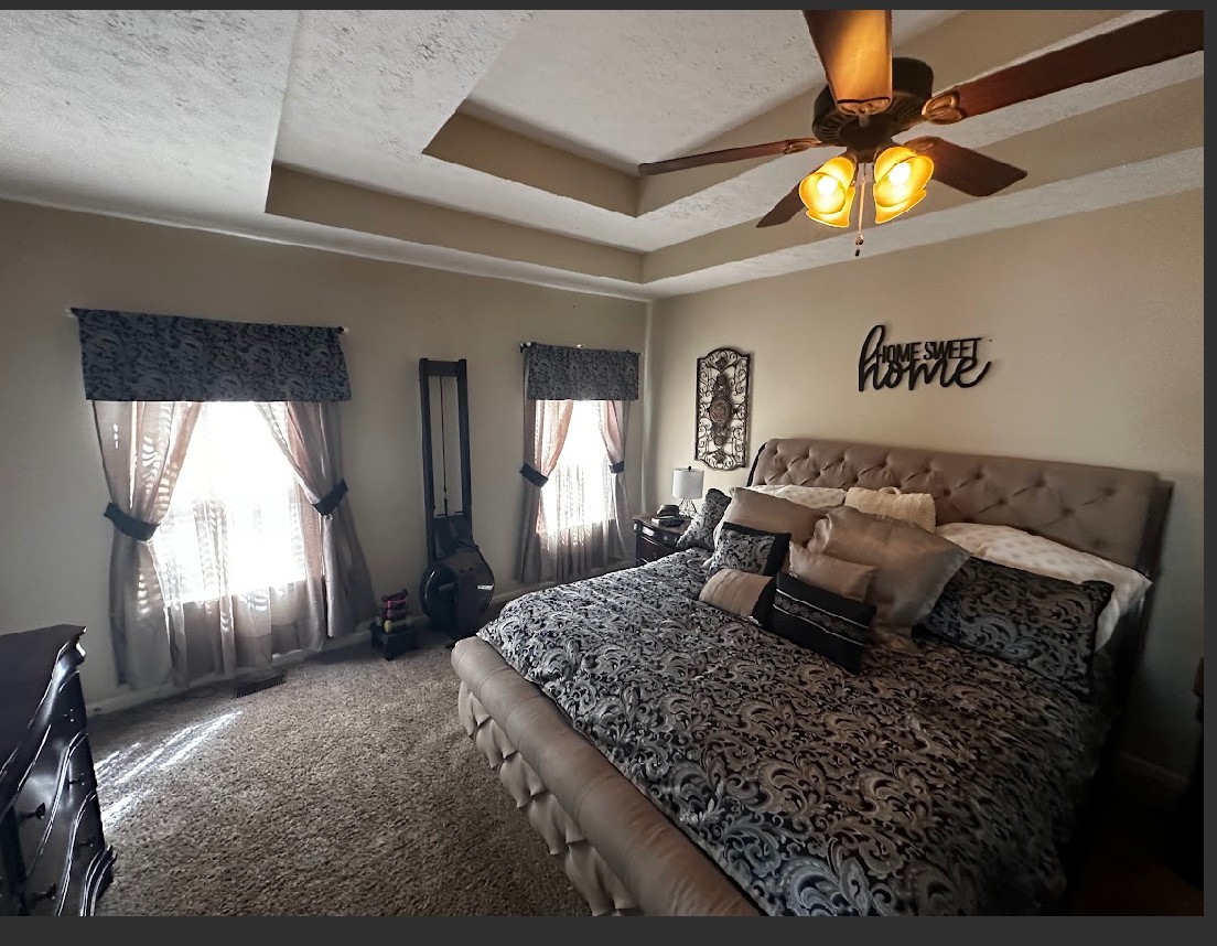 495 Calista Road White House, TN 37188 - Photo 17 of 28 a bedroom with a large bed and a chandelier