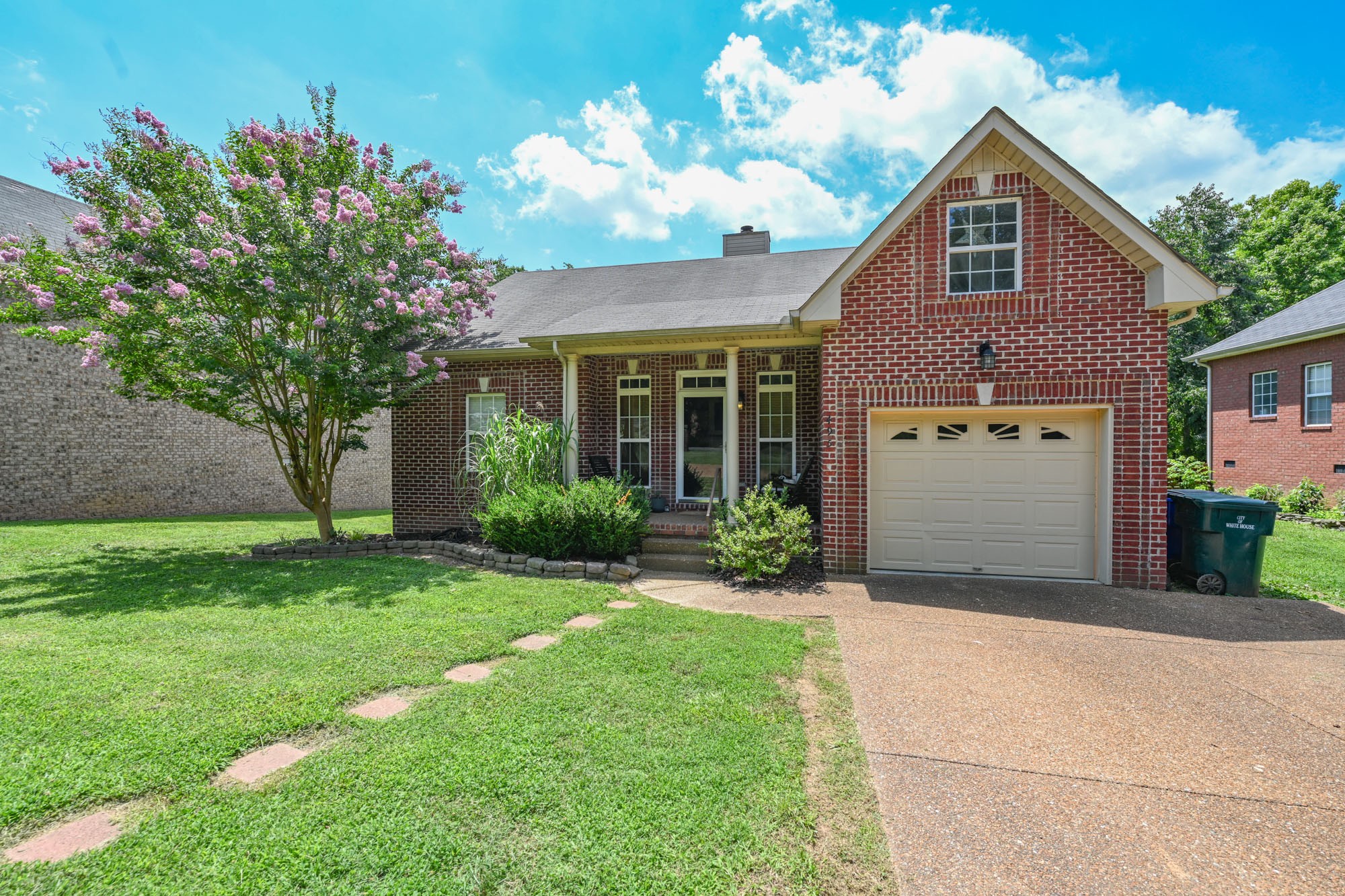 495 Calista Road White House, TN 37188 - Photo 3 of 28 a front view of a house with a yard and garage