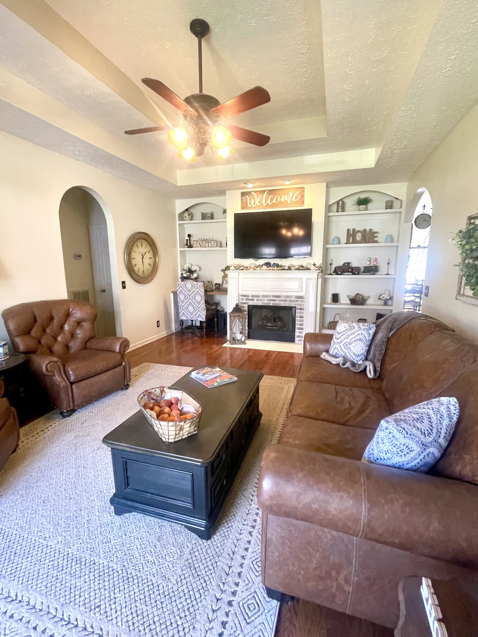 495 Calista Road White House, TN 37188 - Photo 5 of 28 a living room with furniture a flat screen tv and a fireplace