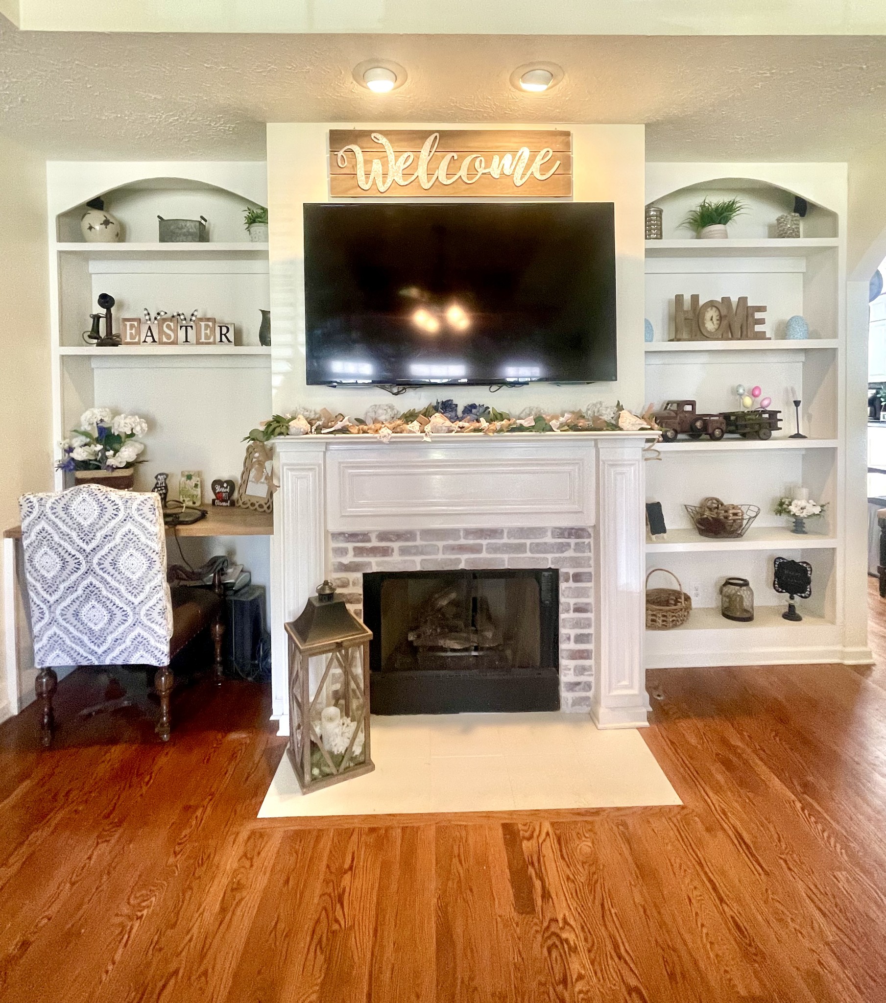 495 Calista Road White House, TN 37188 - Photo 7 of 28 a living room with furniture a flat screen tv and a fireplace